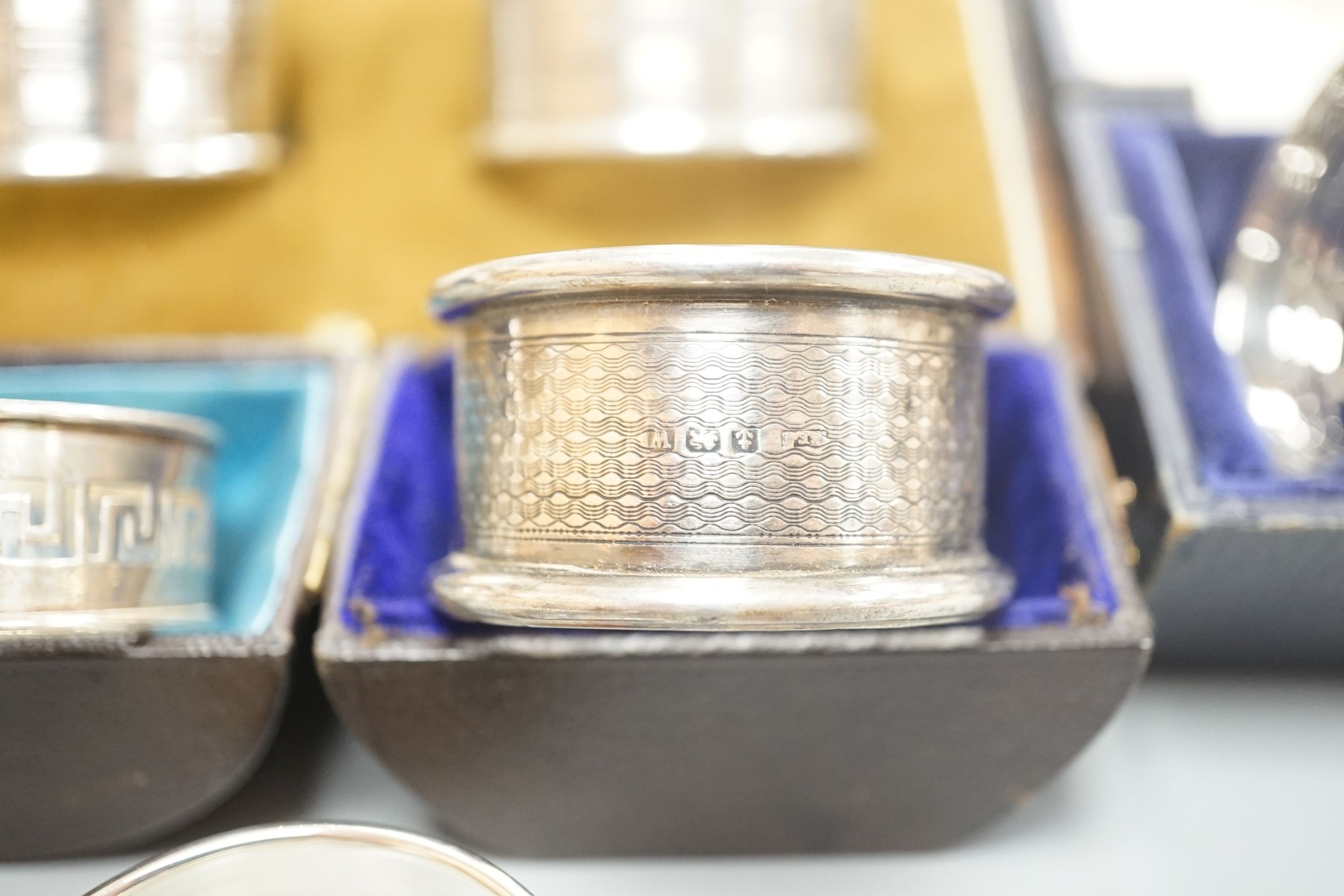 A cased pair of George V silver napkin rings by Charles Horner, Chester, 1924, one other cased pair of silver napkin rings and four assorted cased single silver napkin rings.